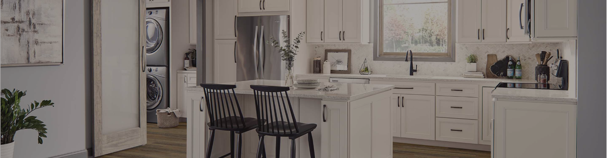 White cabinets in a kitchen with wood-look flooring from our Sugar Land flooring store