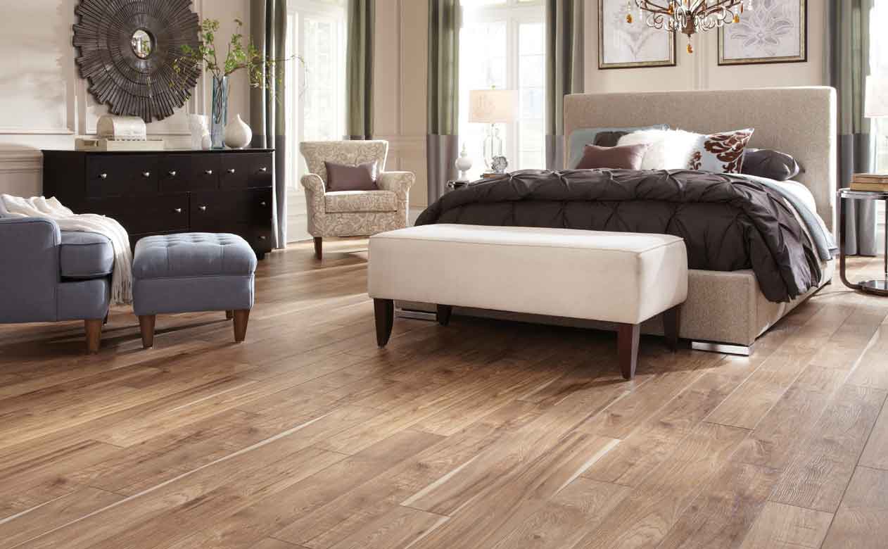 Sugar Land, TX bedroom with wood look tile flooring 
